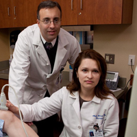 two doctors performing a procedure