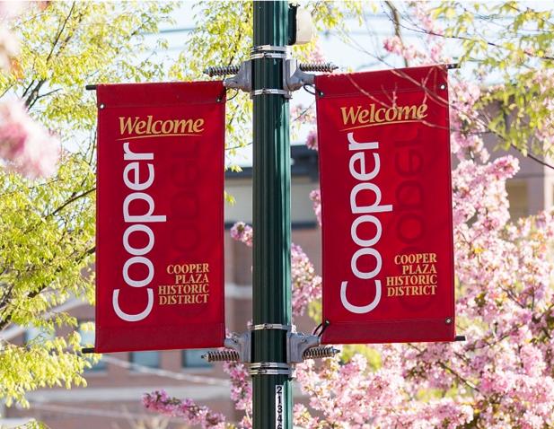 Two red banners on the Cooper campus