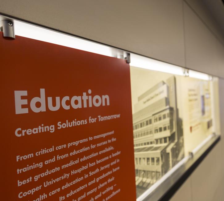 Signage from Cooper Hospital lobby. Heading reads "Education".