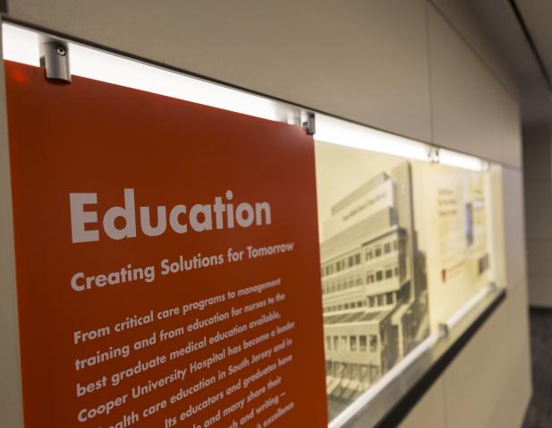 Education panel in Roberts Pavilion hall entrance.