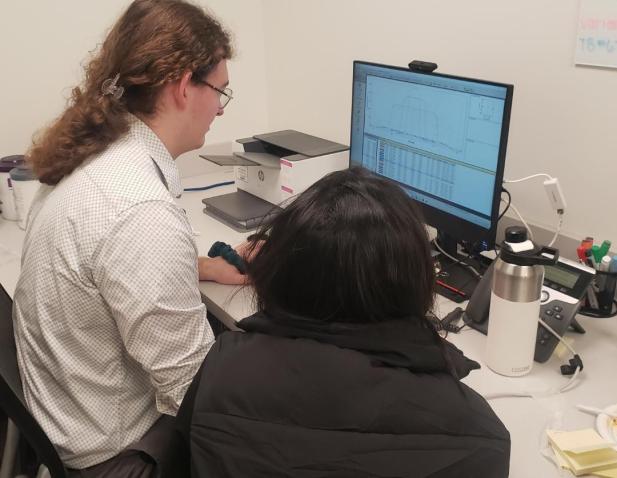 Medical physicists at a computer
